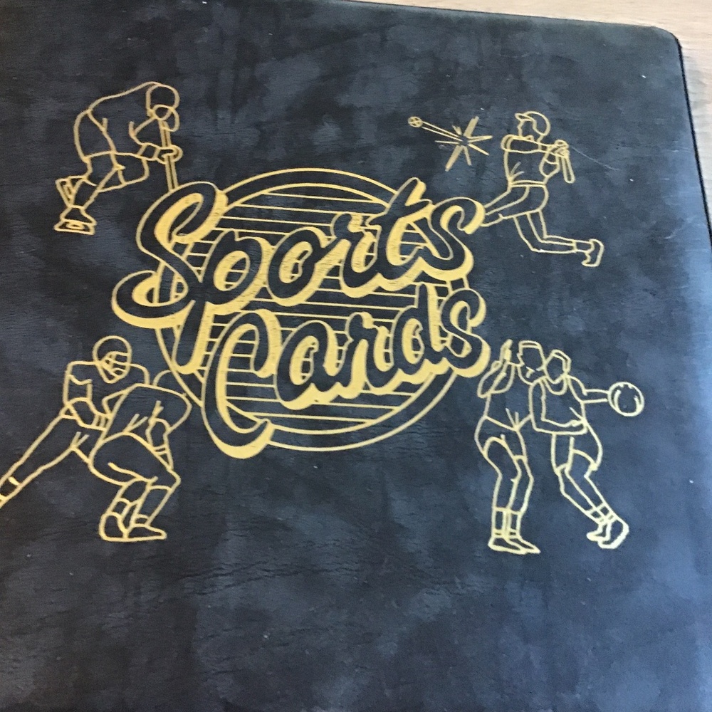 Sports card binder includes card sets